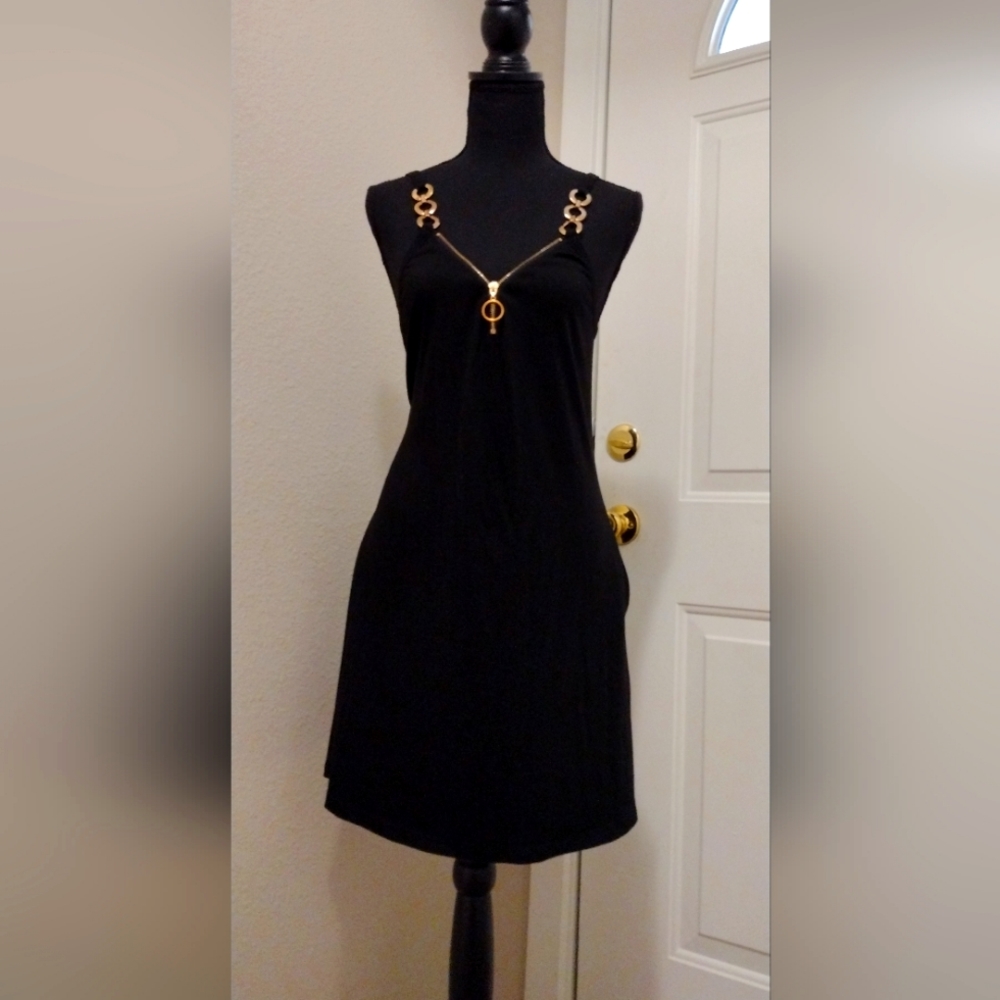 Black dress. With gold chain